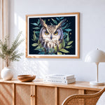 Majestic owl with green leaves cross stitch artwork displayed on wall as home decor