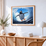 Majestic penguin swimming in a wave cross stitch artwork displayed on wall as home decor