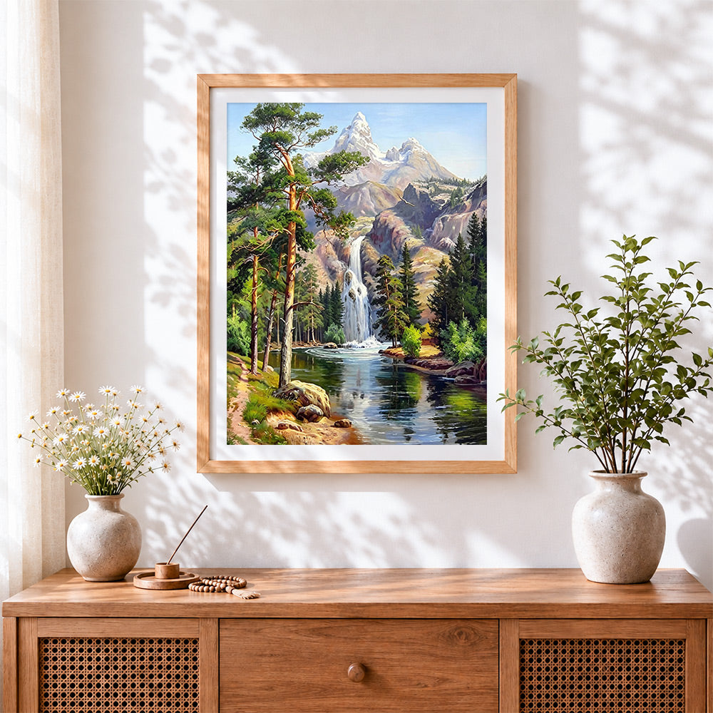 Finished majestic snowy mountain waterfall cross stitch artwork displayed