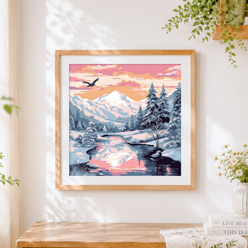 Finished majestic snowy mountains at sunset cross stitch artwork displayed