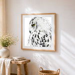 Majestic snowy owl close up cross stitch artwork displayed on wall as home decor