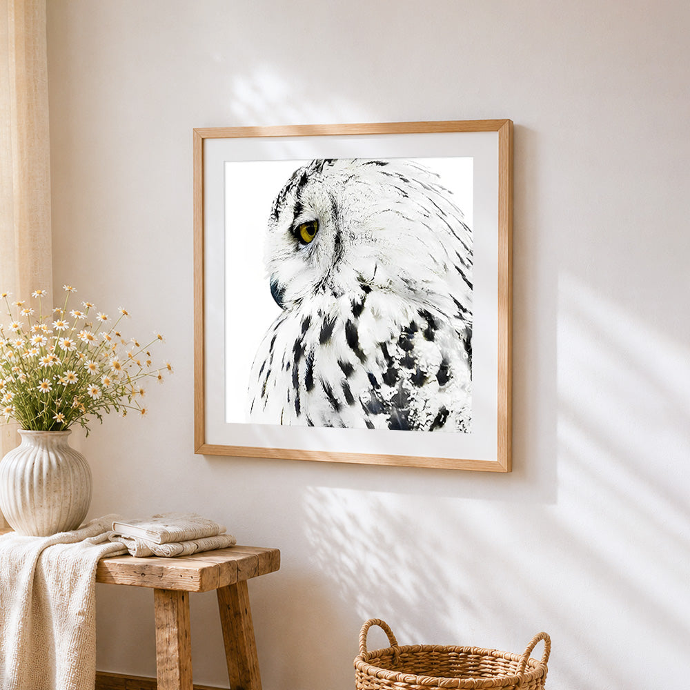 Majestic snowy owl close up cross stitch artwork displayed on wall as home decor