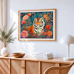 Majestic tiger among flowers cross stitch artwork displayed on wall as home decor