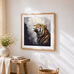 Majestic tiger looking up cross stitch artwork displayed on wall as home decor