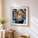Majestic tiger swimming in water cross stitch artwork displayed on wall as home decor