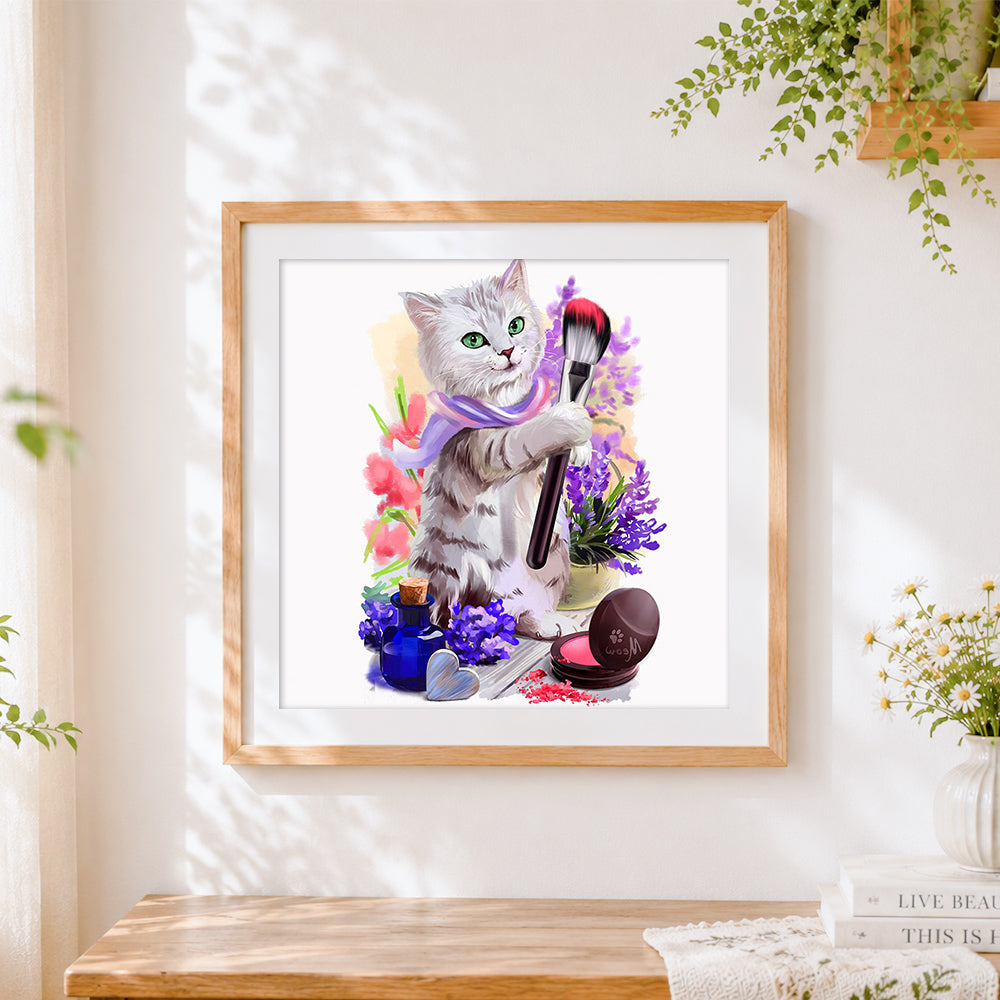 Finished makeup artist cat cross stitch artwork displayed