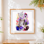 Finished makeup artist cat cross stitch artwork displayed