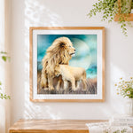 Finished male lion and cub cross stitch artwork displayed