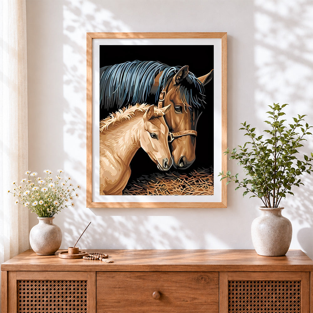 Finished mare and foal cross stitch artwork displayed