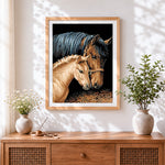 Finished mare and foal cross stitch artwork displayed