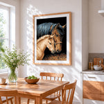 Mare and foal cross stitch artwork displayed on wall as home decor