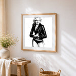 Marilyn monroe black and white illustration cross stitch artwork displayed on wall as home decor