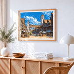 Medieval town street cross stitch artwork displayed on wall as home decor