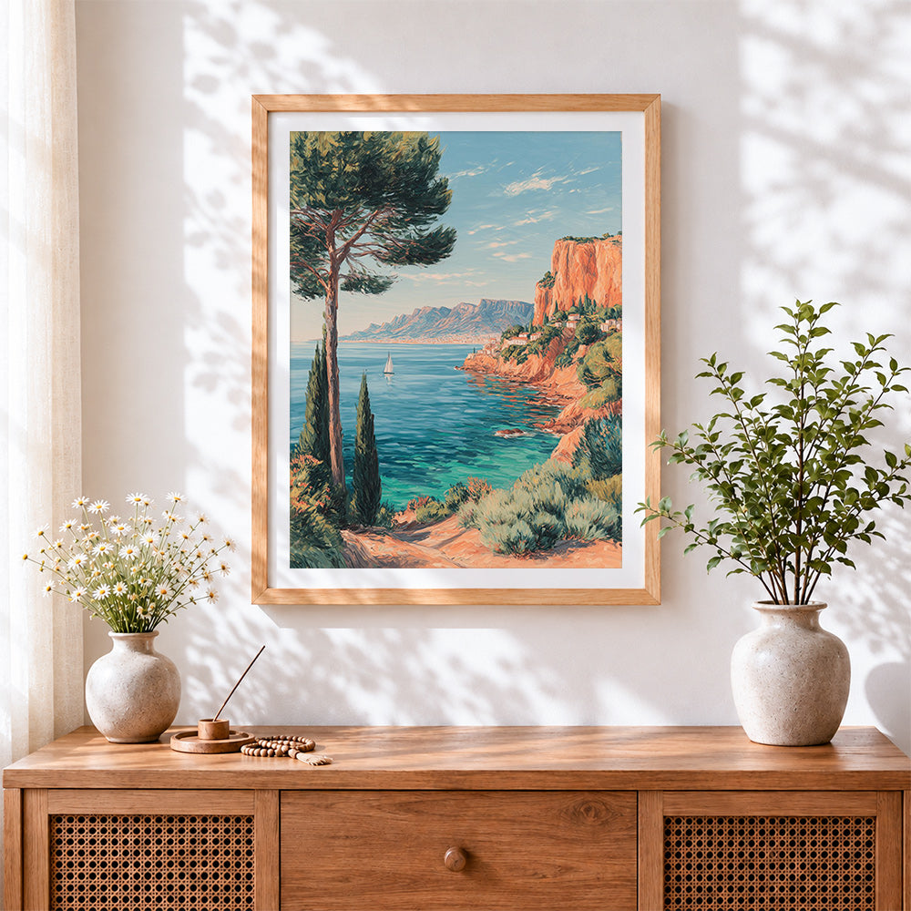 Finished mediterranean cliffside and sailboat cross stitch artwork displayed