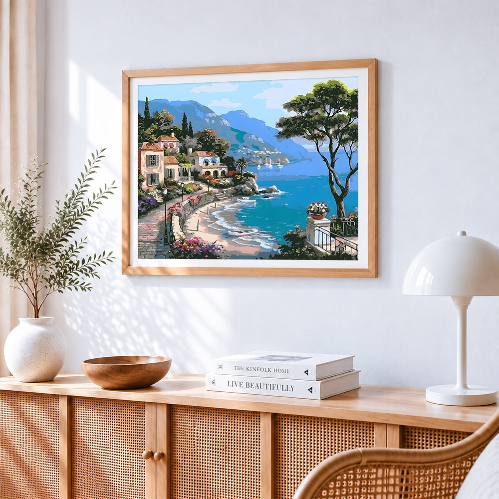Mediterranean coastal village cross stitch artwork displayed on wall as home decor