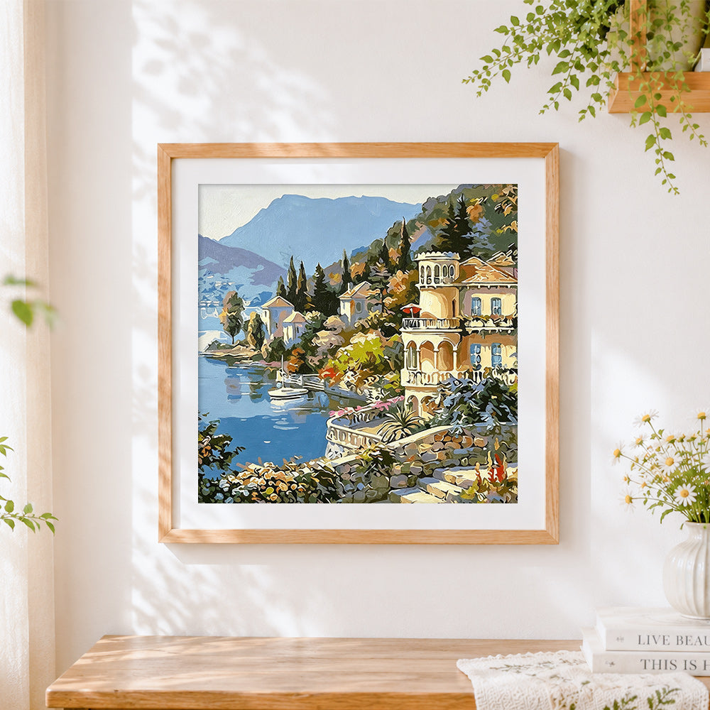 Finished mediterranean lake house cross stitch artwork displayed