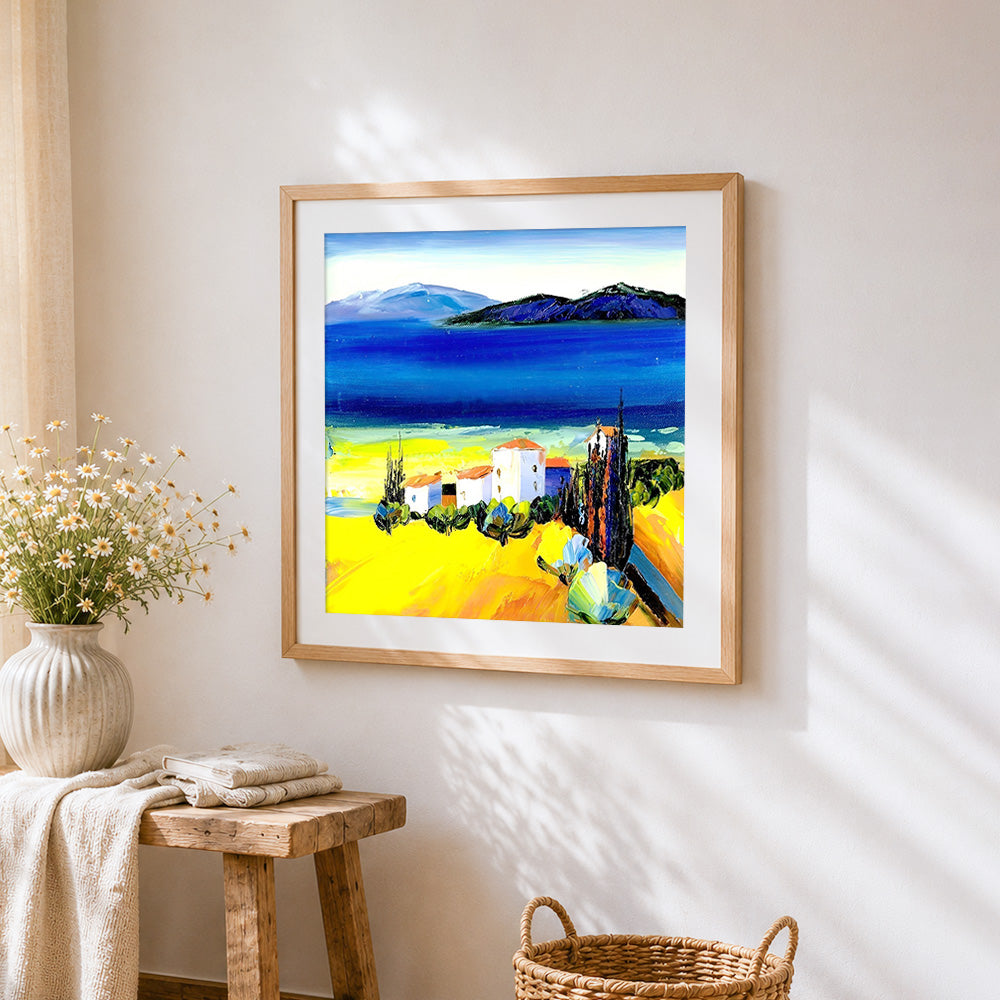Mediterranean white village cross stitch artwork displayed on wall as home decor