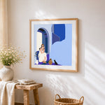 Mediterranean woman with cat cross stitch artwork displayed on wall as home decor