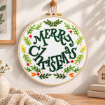 Merry christmas wreath embroidery hoop wall art displayed as warm and cosy handmade home decor