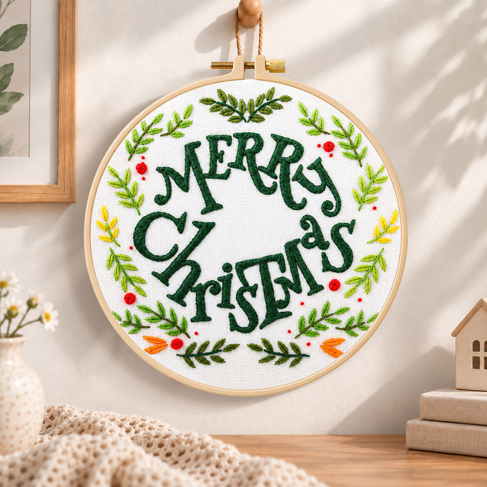 Merry christmas wreath embroidery hoop wall art displayed as warm and cosy handmade home decor