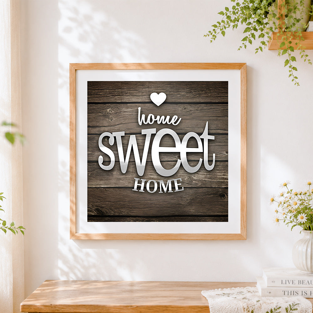 Finished metallic home sweet home on wood print cross stitch artwork displayed