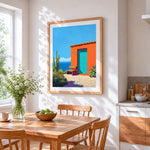 Mexican orange casita and cactus cross stitch artwork displayed on wall as home decor