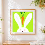 Finished minimalist bunny and carrot cross stitch artwork displayed