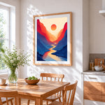 Minimalist canyon and red sun cross stitch artwork displayed on wall as home decor