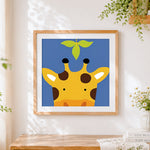 Finished minimalist cute giraffe cross stitch artwork displayed