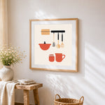 Minimalist hanging kitchenware cross stitch artwork displayed on wall as home decor