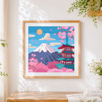 Finished minimalist mount fuji and pagoda cross stitch artwork displayed