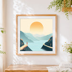 Finished minimalist mountains at sunrise cross stitch artwork displayed