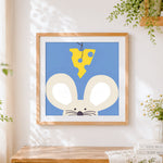 Finished minimalist mouse and cheese cross stitch artwork displayed