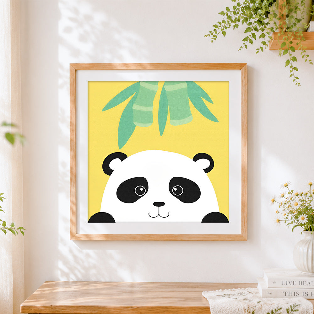 Finished minimalist panda face cross stitch artwork displayed