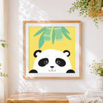 Finished minimalist panda face cross stitch artwork displayed