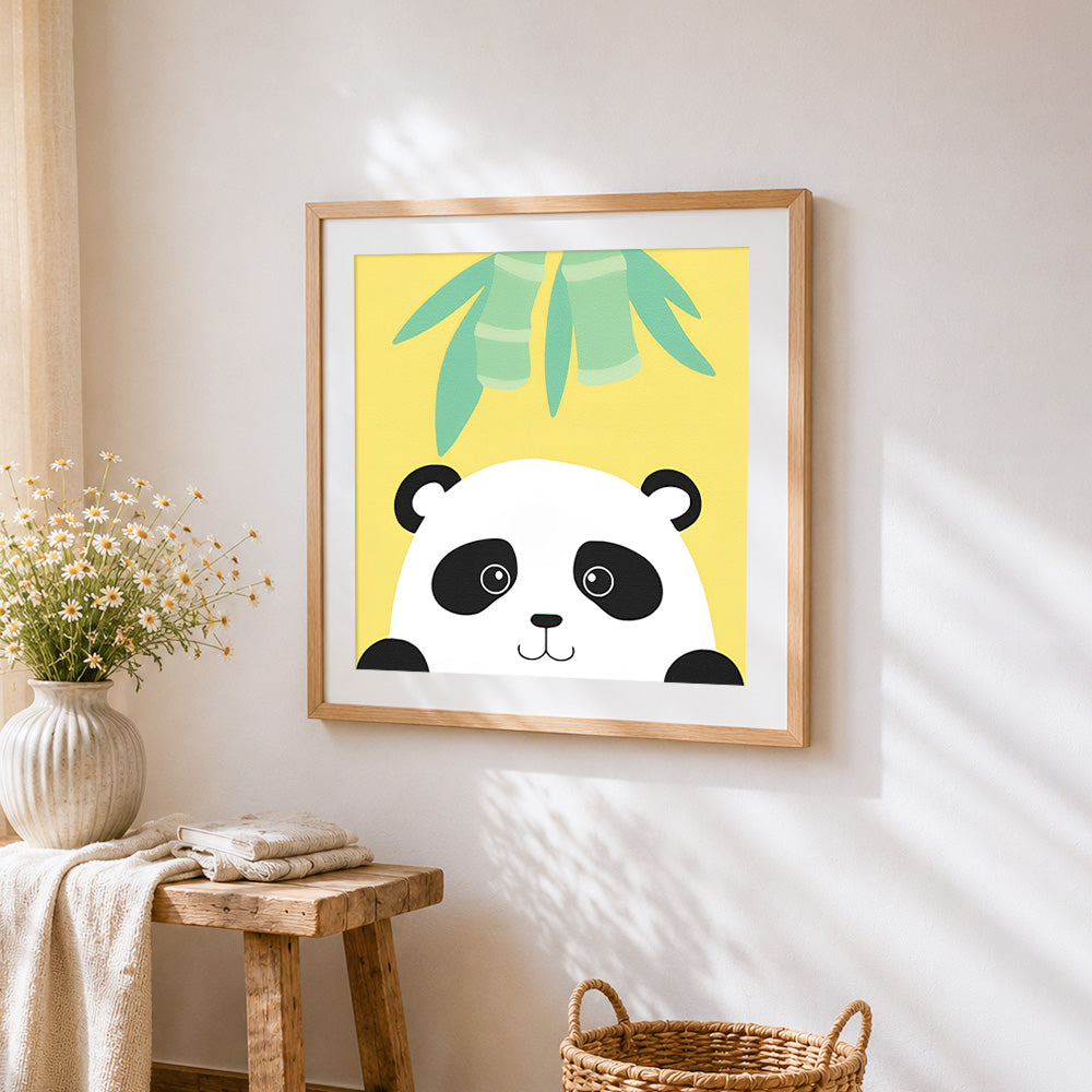 Minimalist panda face cross stitch artwork displayed on wall as home decor