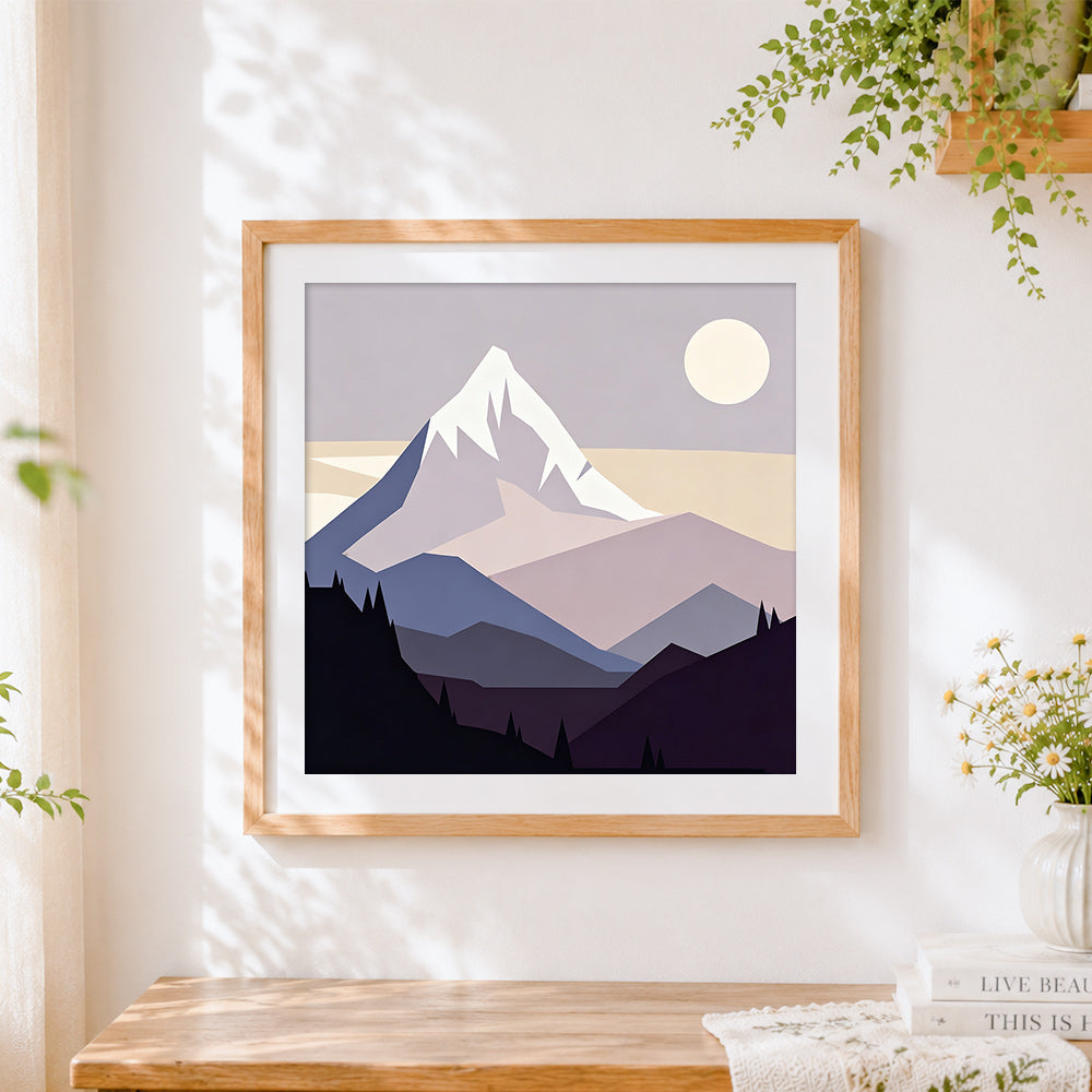 Finished minimalist snowy mountain cross stitch artwork displayed