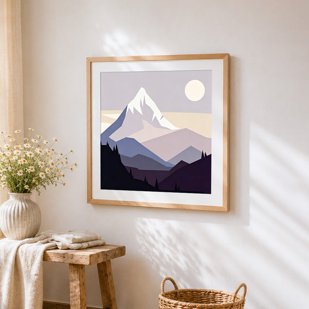 Minimalist snowy mountain cross stitch artwork displayed on wall as home decor