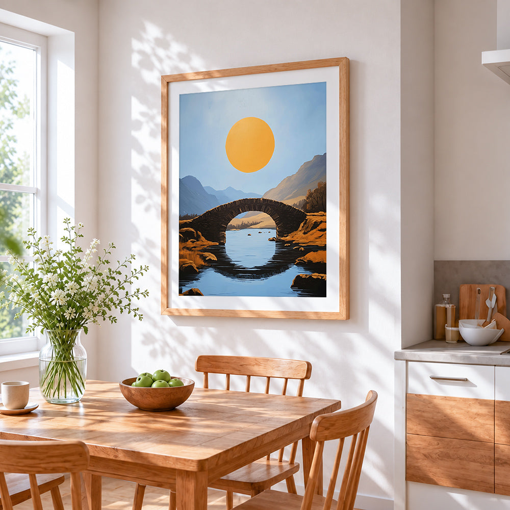 Minimalist stone bridge and golden sun cross stitch artwork displayed on wall as home decor