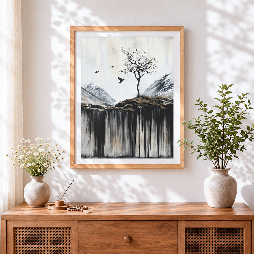 Finished minimalist winter tree and crows cross stitch artwork displayed