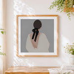 Finished minimalist woman with black bow paint by numbers artwork displayed as home decor
