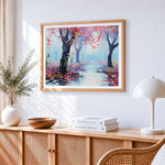 Misty pink blossom forest cross stitch artwork displayed on wall as home decor