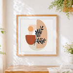 Finished modern abstract botanical shapes cross stitch artwork displayed