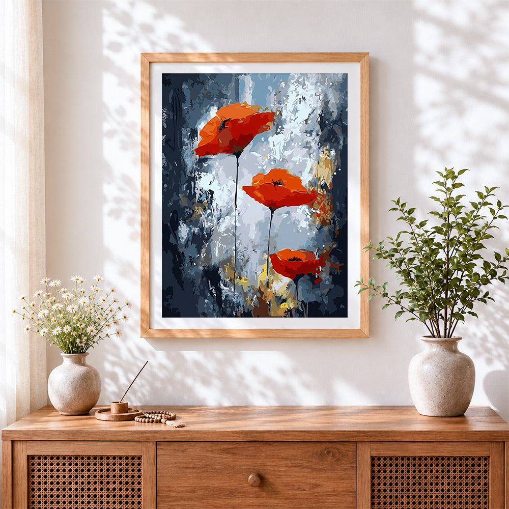 Finished modern abstract red poppies cross stitch artwork displayed