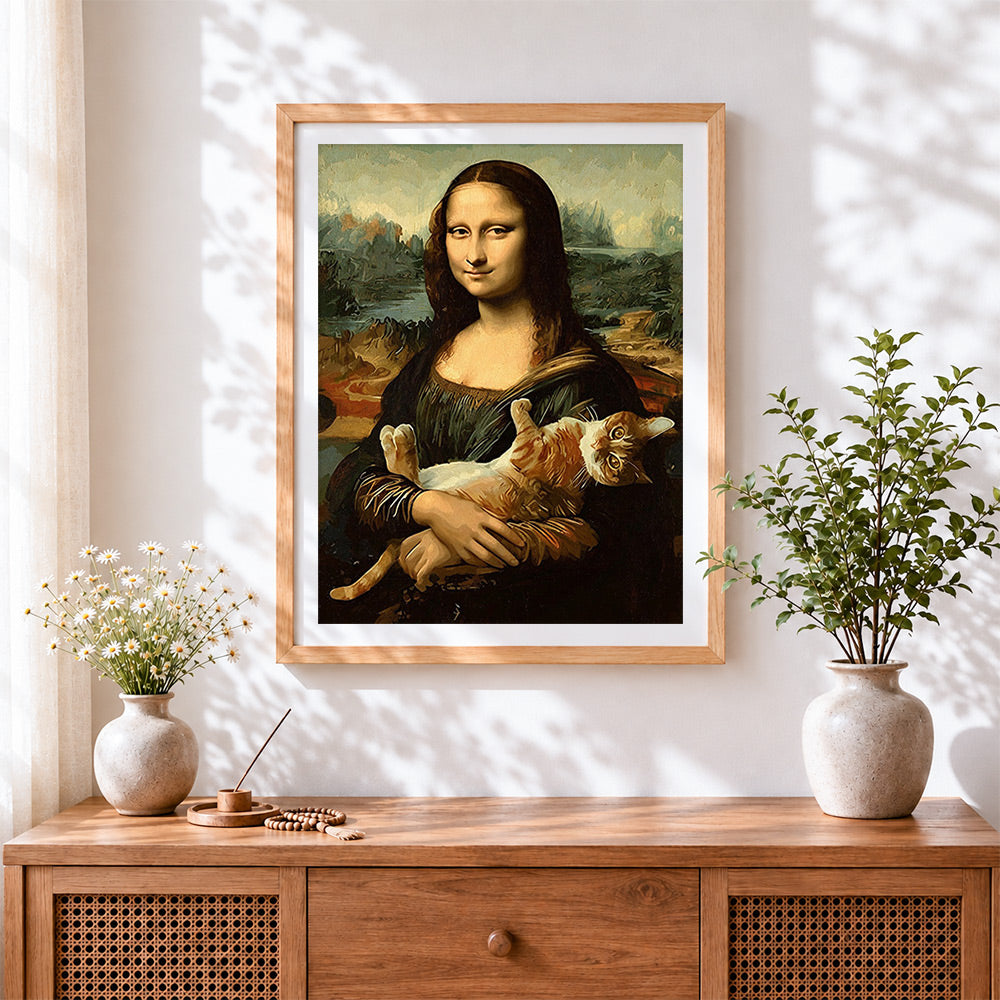 Finished mona lisa with a ginger cat cross stitch artwork displayed