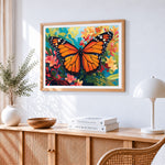 Monarch butterfly on a floral background cross stitch artwork displayed on wall as home decor