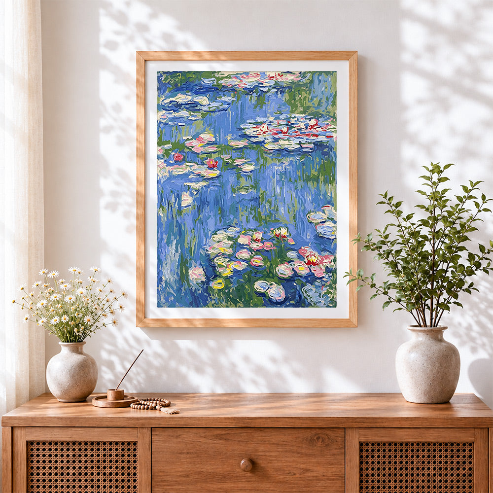 Finished monet style pink water lilies cross stitch artwork displayed
