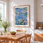 Monet style pink water lilies cross stitch artwork displayed on wall as home decor