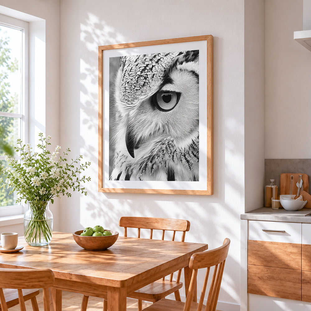 Monochrome owl eye close up cross stitch artwork displayed on wall as home decor