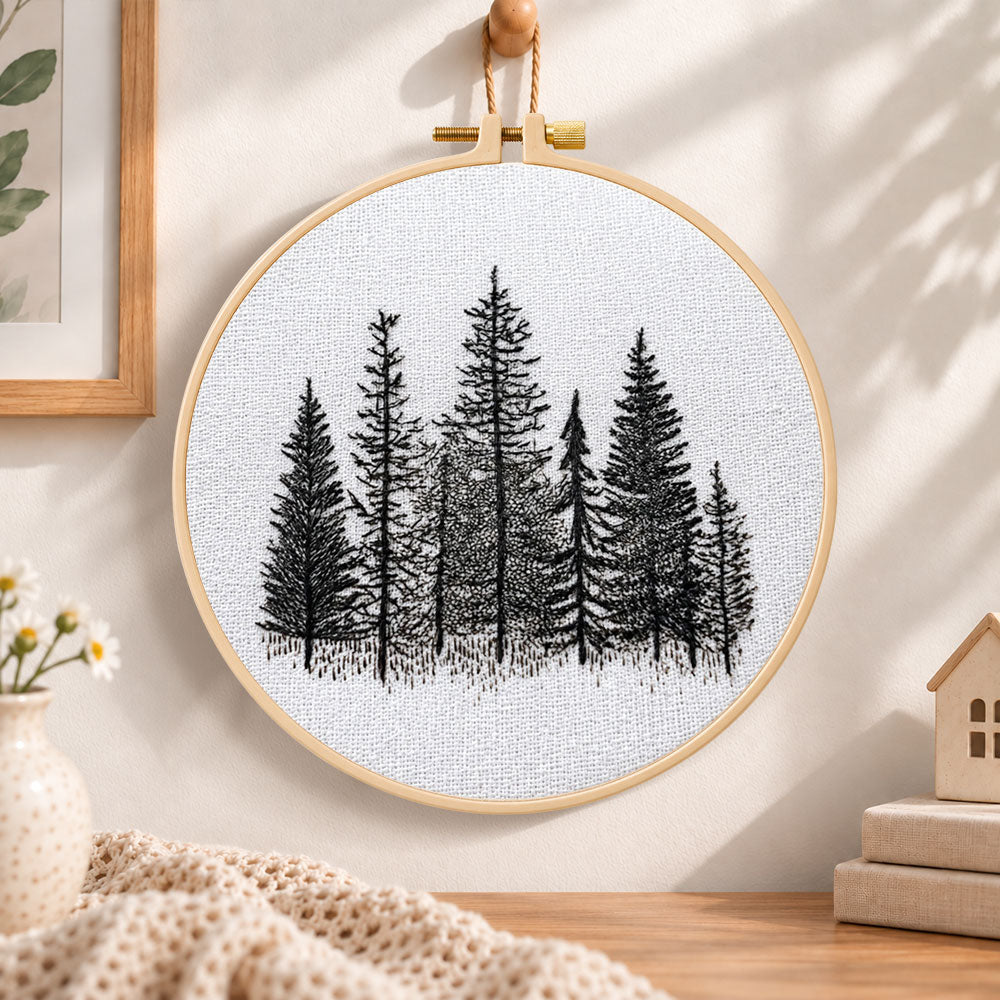Monochrome pine woods embroidery hoop wall art displayed as warm and cosy handmade home decor